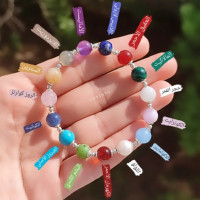 اسورة فاخرة مصممة من اكثر من  12 نوع حجر طبيعي مختلف بفواصل فضة استرليني عيار 925